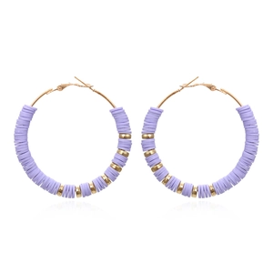 Detail of Bohemian hoop earrings featuring purple clay discs and gold metallic beads