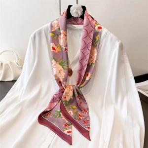 Elegant purple silk-like scarf with floral patterns on a white shirt for office wear