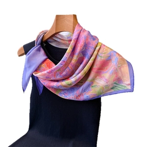 Artistic oil painting style silk square scarf styled on a black vest with wooden hanger