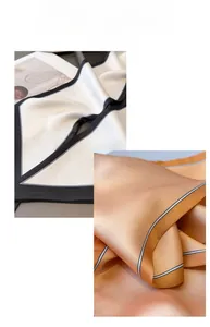 Close-up of elegant satin scarves with contrasting edges showing silky texture and sheen