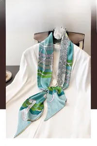 Detail of vintage equestrian chain pattern silk scarf in mint green on a white suit