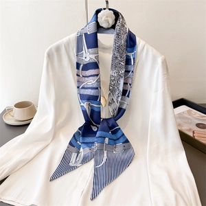 Elegant navy equestrian chain print satin skinny scarf styled on white shirt