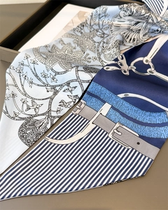 Detail of elegant narrow silk scarves featuring vintage chain and nature prints