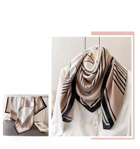 Detail view of geometric silk scarf in beige and black on white professional blazer
