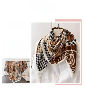 Close-up of houndstooth and vintage rose patterns on silk-like printed square scarf