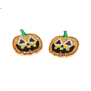Halloween pumpkin stud earrings with sparkling orange rhinestones and green enamel details