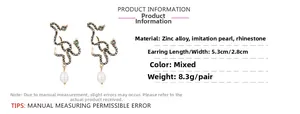 Detail view of snake earrings with dimensions 5.3cm x 2.8cm and teardrop pearl drops