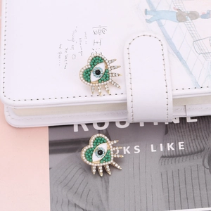 Minimalist evil eye heart stud earrings with green beads and pearl trim for women