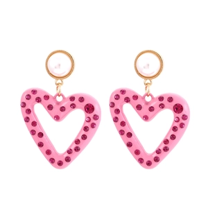 Pink heart drop earrings with crystals and pearl studs on a polished gold alloy base