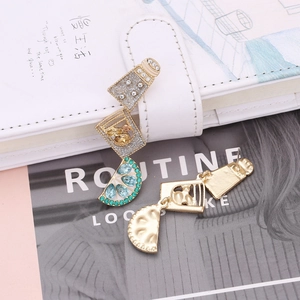 Detail of creative multilayer earrings with fruit slices and wine glass charms