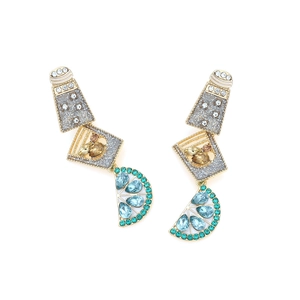 Macro shot of tiered cocktail earrings with lemon slices and crystal bottle charms