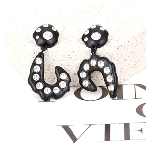 Asymmetrical black geometric drop earrings with sparkling rhinestones and metal finish