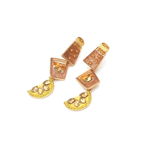 Detailed macro of crystal wine bottle earrings with lemon charms and yellow enamel