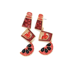 Detail of multi-layer alloy drop oil earrings with watermelon and rhinestone accents