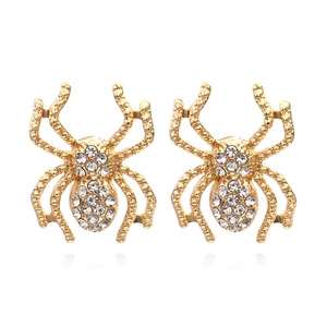 Vintage gold spider stud earrings with sparkling white crystals on a white background