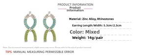 Detailed view of rhinestone infinity earrings with blue and green crystals and size specs