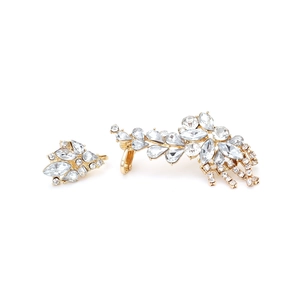 Detailed close-up of gold-plated leaf earrings with sparkling rhinestone tassels
