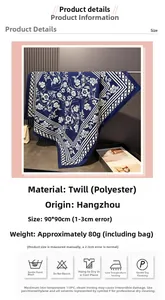 Detail of 90x90cm floral satin scarf showing blue pattern and care instructions