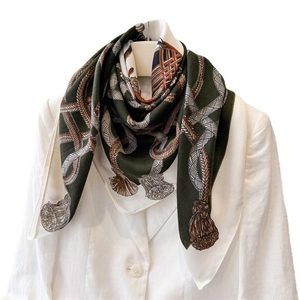 Elegant equestrian silk scarf with rope print on white blazer for business attire