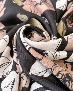 Macro shot of vintage floral silk scarf fabric showing twill texture and rose print