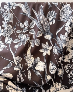 Close-up of floral print silk scarf showing soft drape and vintage flower patterns