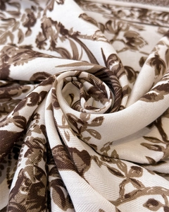 Macro detail of French Toile de Jouy silk scarf showing vintage floral pattern and texture