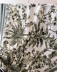 Detailed close-up of French jungle floral print on silk-like fabric with herringbone texture