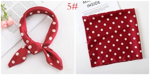 Detail of red silk satin square scarf with white polka dots showing knotted and flat views