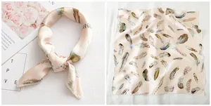 Detail of silk-like satin square scarf featuring elegant feather print and soft beige tones