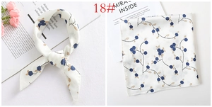 Detail of white satin square scarf with blue floral prints and 18# item label
