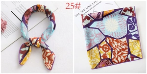 Detailed close-up of 50x50cm floral silk square scarf with vintage pattern and stitching