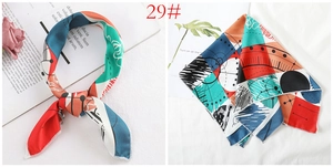 Detail of artistic geometric print silk scarf with colorful abstract patterns