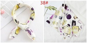 Silk square scarf featuring vintage perfume bottle prints and an elegant white base