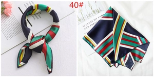 Detailed view of striped satin square scarf with premium geometric print and flat stitching