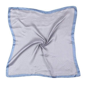 Square silk scarf with blue geometric patterns and satin texture on white background