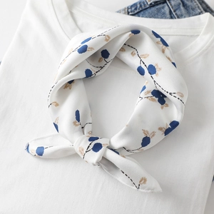 Elegant white square silk scarf with blue berry floral print on white t-shirt