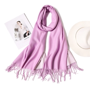 Detail of soft lavender reversible scarf with handmade fringe and cashmere-like texture