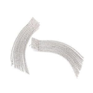 Detailed view of silver long fringe earrings with shimmering rhinestones on white background