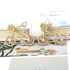 Cartoon bicycle earrings with rhinestones, blue enamel details and white pearls