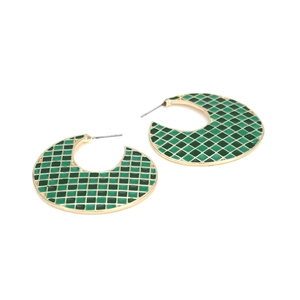 Exaggerated golden C-shaped earrings with green checkerboard enamel mosaic design