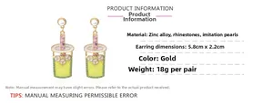 Detailed view of creative milk tea cup earrings with rhinestones, pearls and dimensions