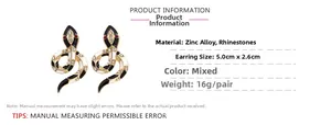 Detailed view of colorful enamel snake earrings with sparkling rhinestones and red eyes