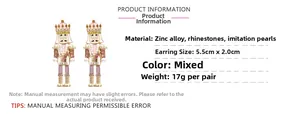 Détails des boucles d'oreilles casse-noisette en alliage de zinc avec strass et émail
