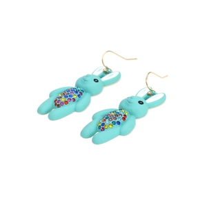 Detailed view of light blue rabbit earrings with colorful rhinestones and gold hooks