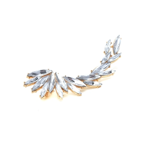 Detailed view of marquise-cut crystal wing ear cuff with golden alloy setting