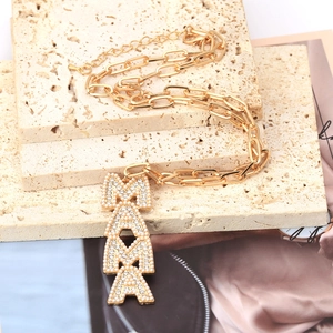 Gold paperclip chain necklace featuring a MAMA pendant with pearls and crystals