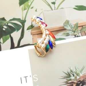 Close-up of alloy ear cuff with colorful marquise crystals and double rows of pearls