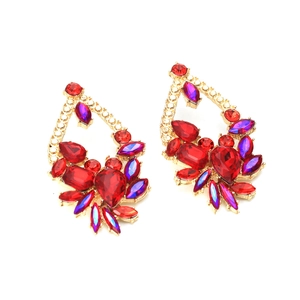 Detailed view of layered geometric drop earrings with purple and red rhinestones