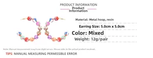 Detail view of Bohemian C-shape hoop earrings with colorful mixed pattern resin beads