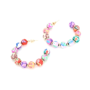 Bohemian colorful C-shaped beaded hoop earrings with vibrant clay flower patterns